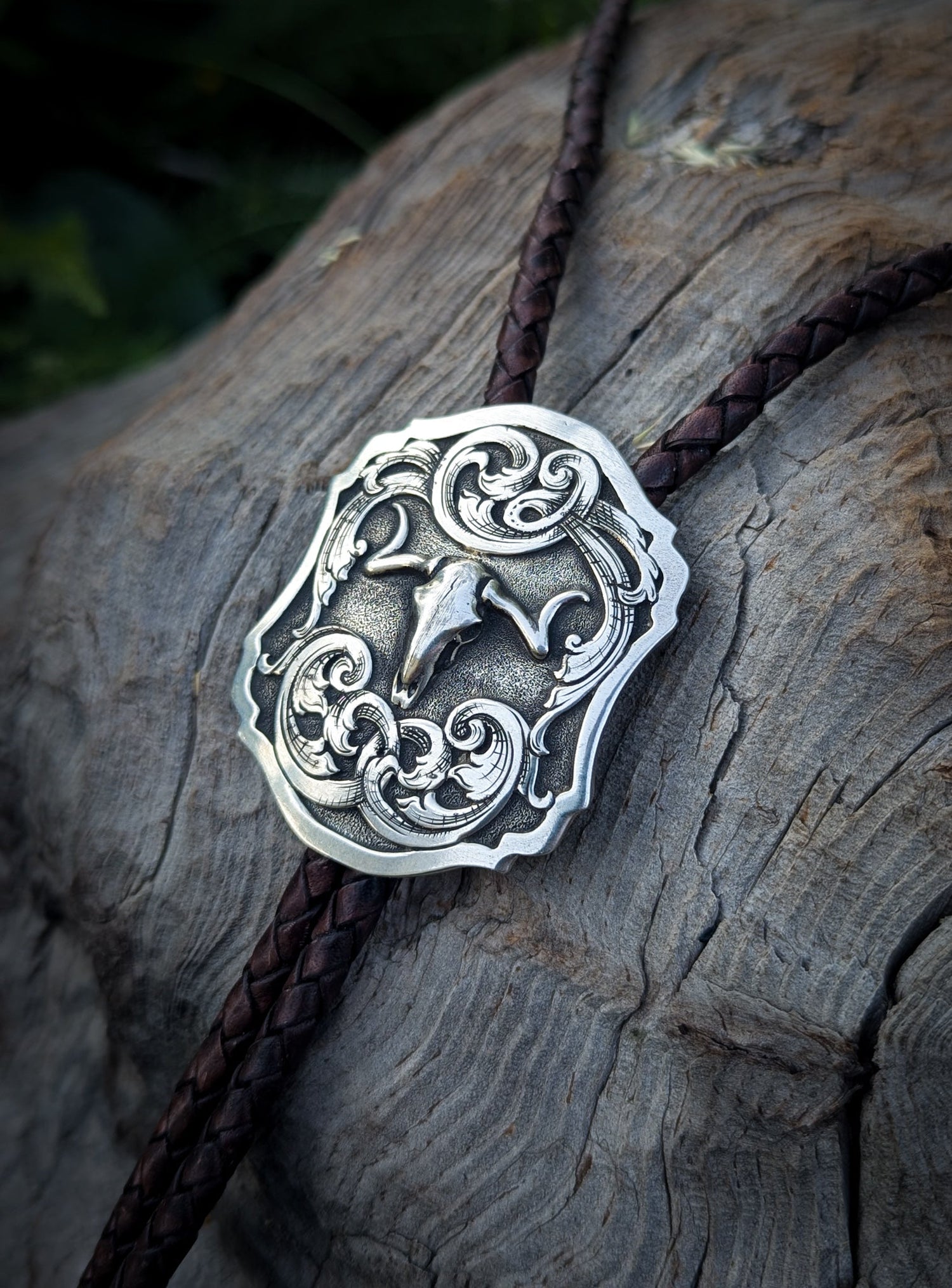 solid Sterling silver Bolo tie featuring engraved Filigree scrolls and longhorn scull. 
