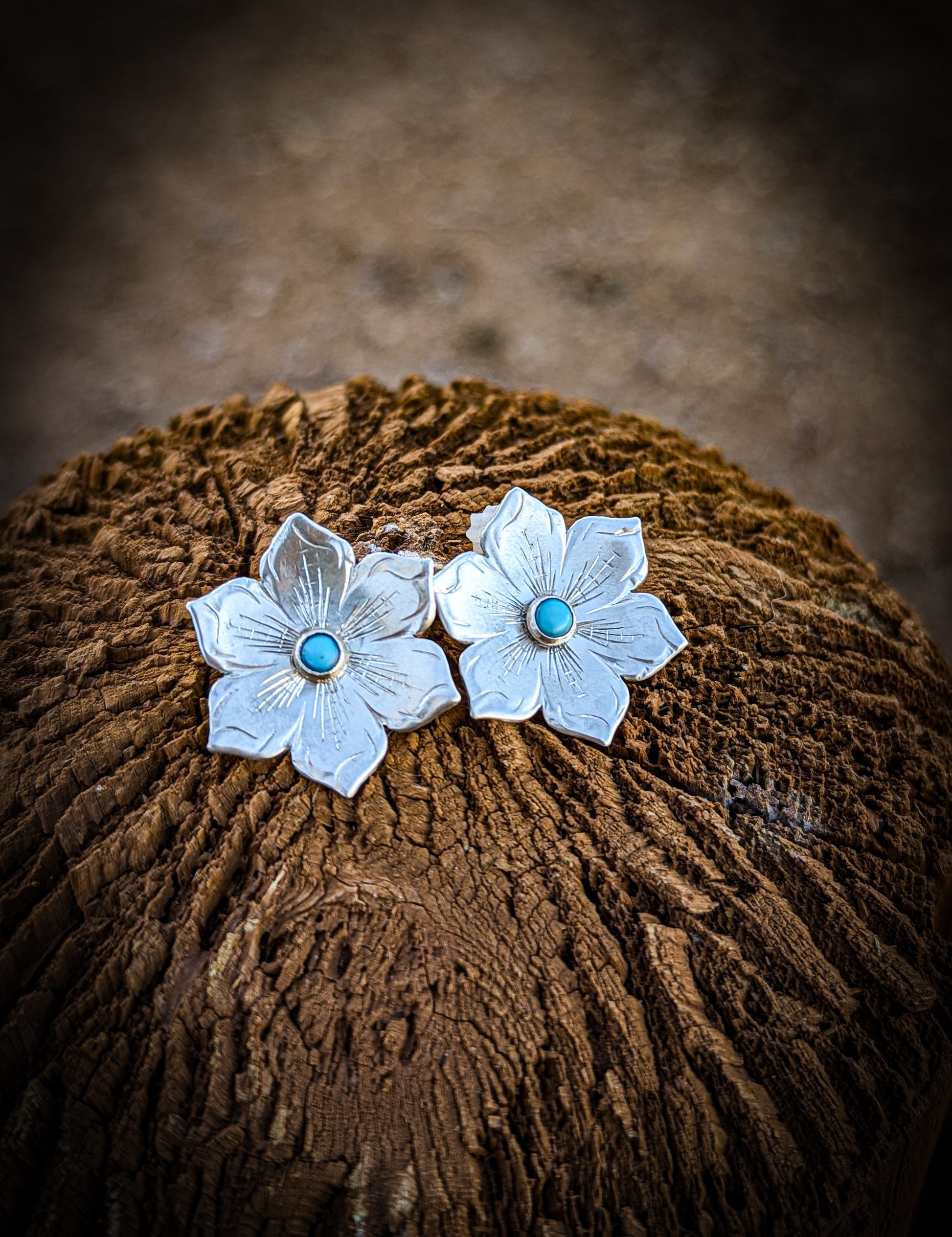 Engraved flower earrings with turquoise center.