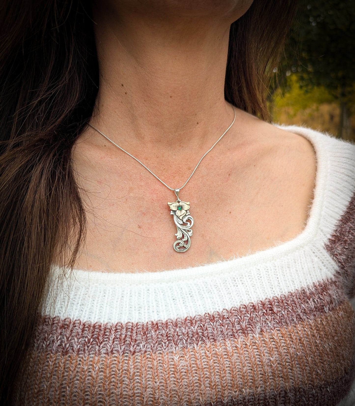 Sterling Silver and Jewelers Bronze Flower Scroll Necklace with simulated emerald center stone