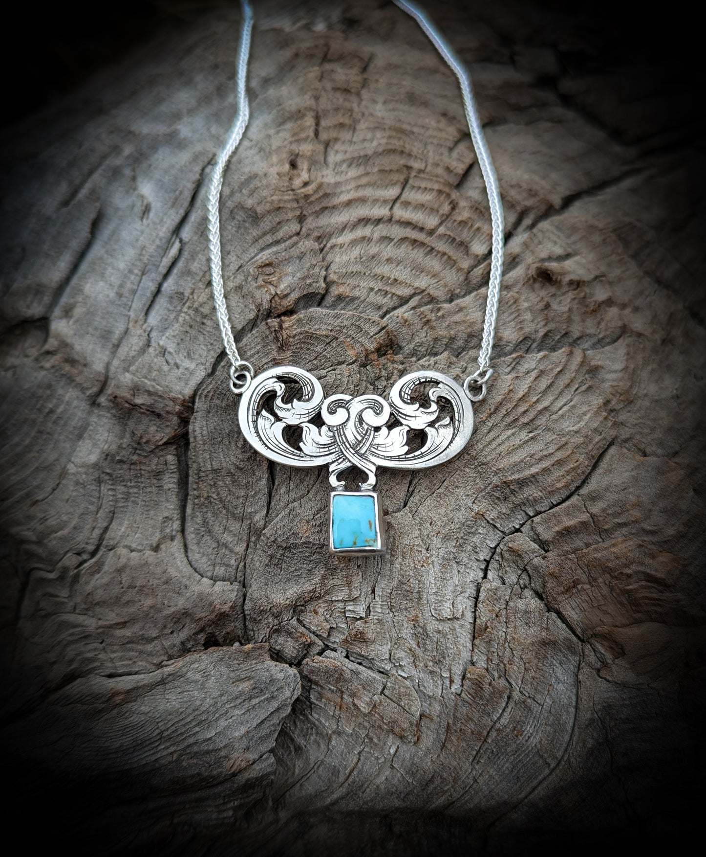 Sterling silver filigree scroll bar style necklace with natural turquoise.
