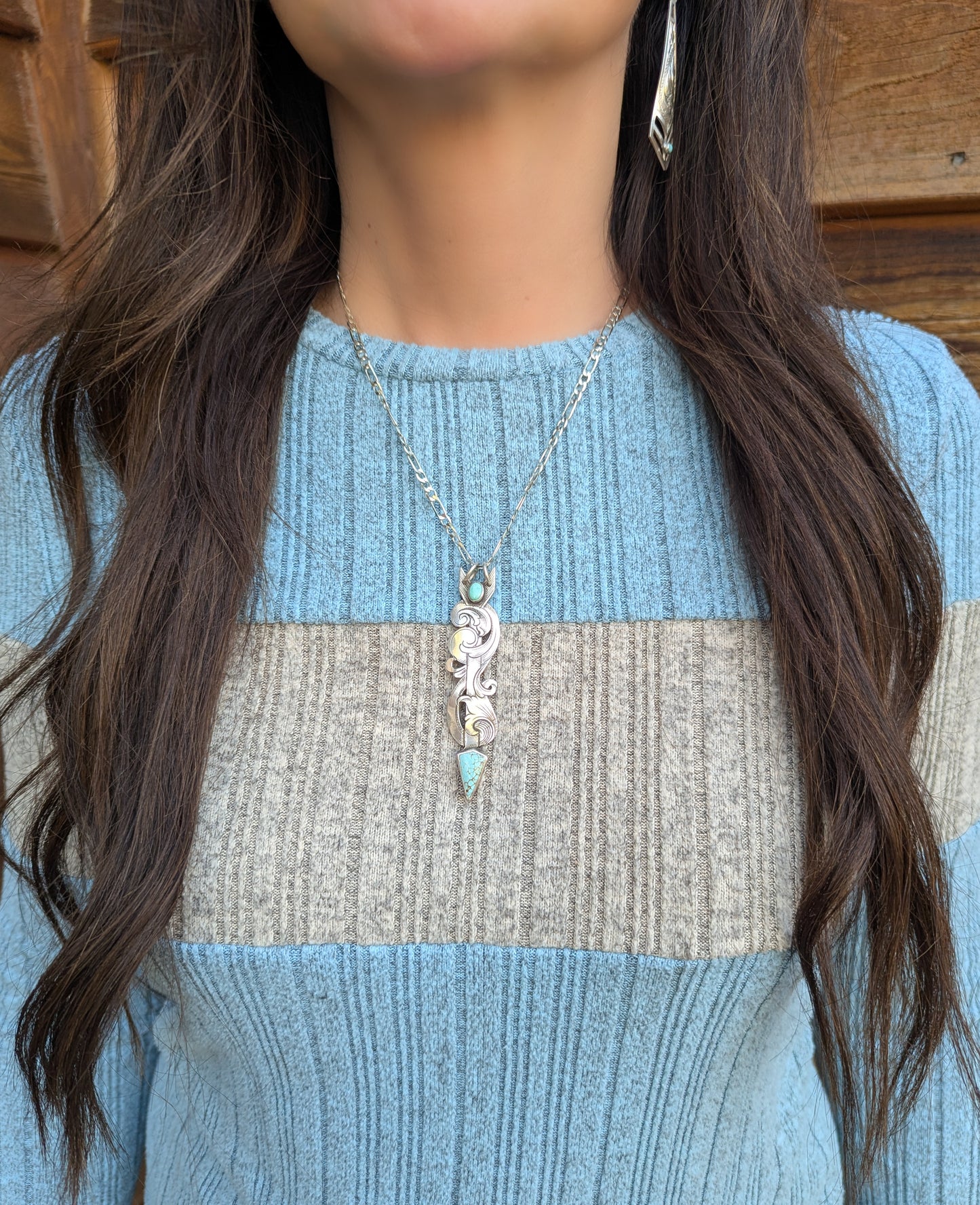 hand engraved sterling silver arrow necklace with turquoise.