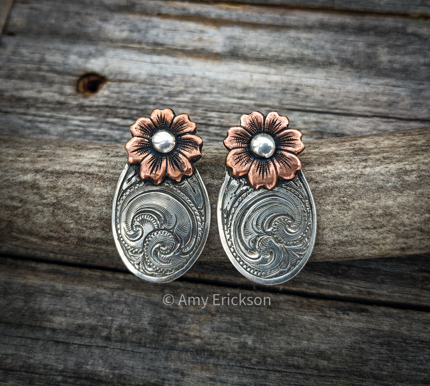 Engraved silver Post earrings.